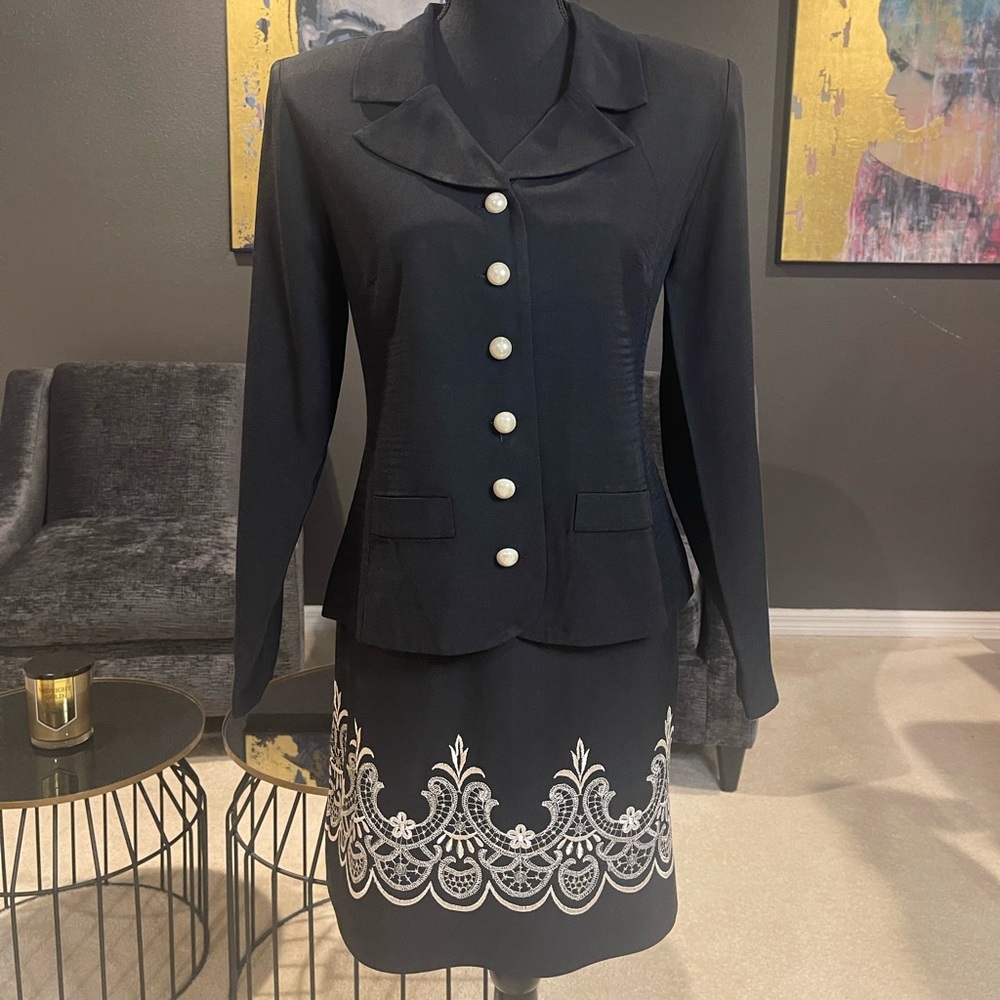 Black skirt suit sat with skirt embroidery and pearl buttons
